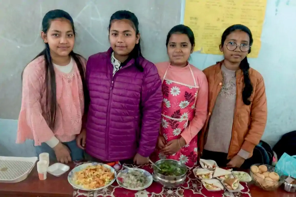 Students at no-flame cooking station