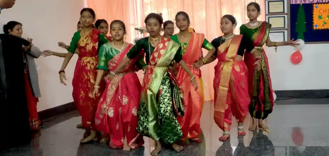 Students performing dance on stage